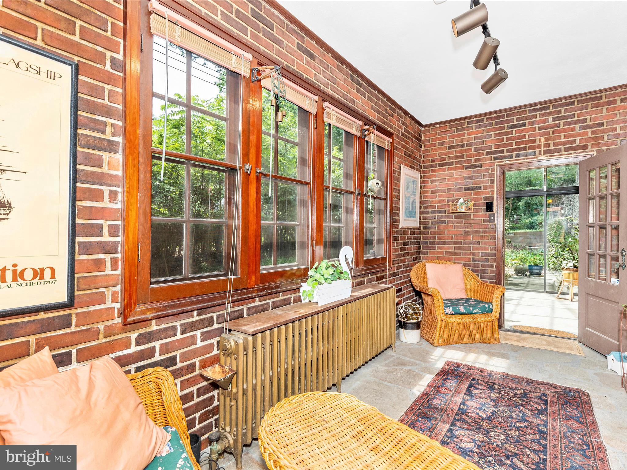 5100 Brook Green Road Baltimore, MD 21229 - Photo 19 of 54 a living room with furniture and floor to ceiling windows