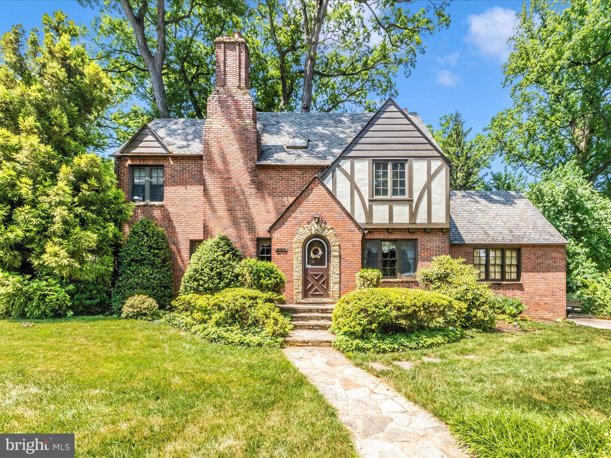 5100 Brook Green Road Baltimore, MD 21229 - Photo 2 of 54 a front view of a house with garden