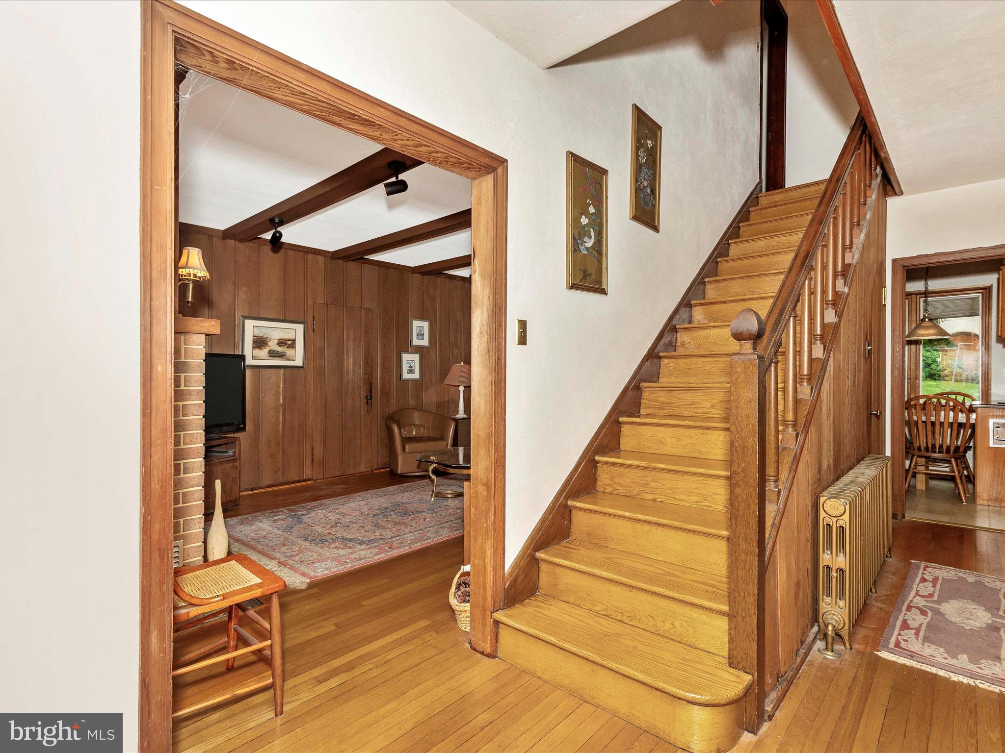 5100 Brook Green Road Baltimore, MD 21229 - Photo 23 of 54 a view of a hallway with wooden floor and staircase