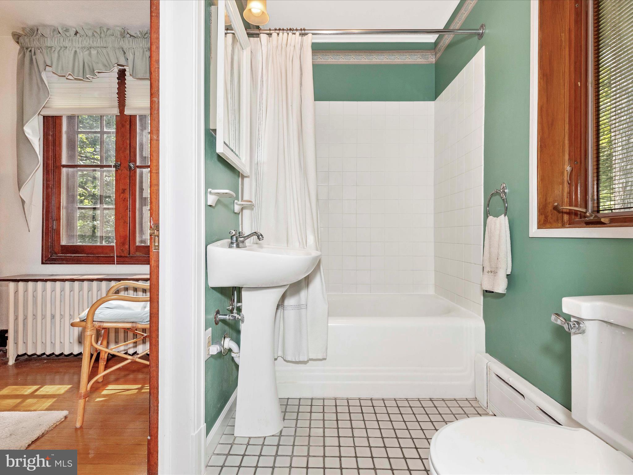 5100 Brook Green Road Baltimore, MD 21229 - Photo 27 of 54 a bathroom with a sink toilet and shower