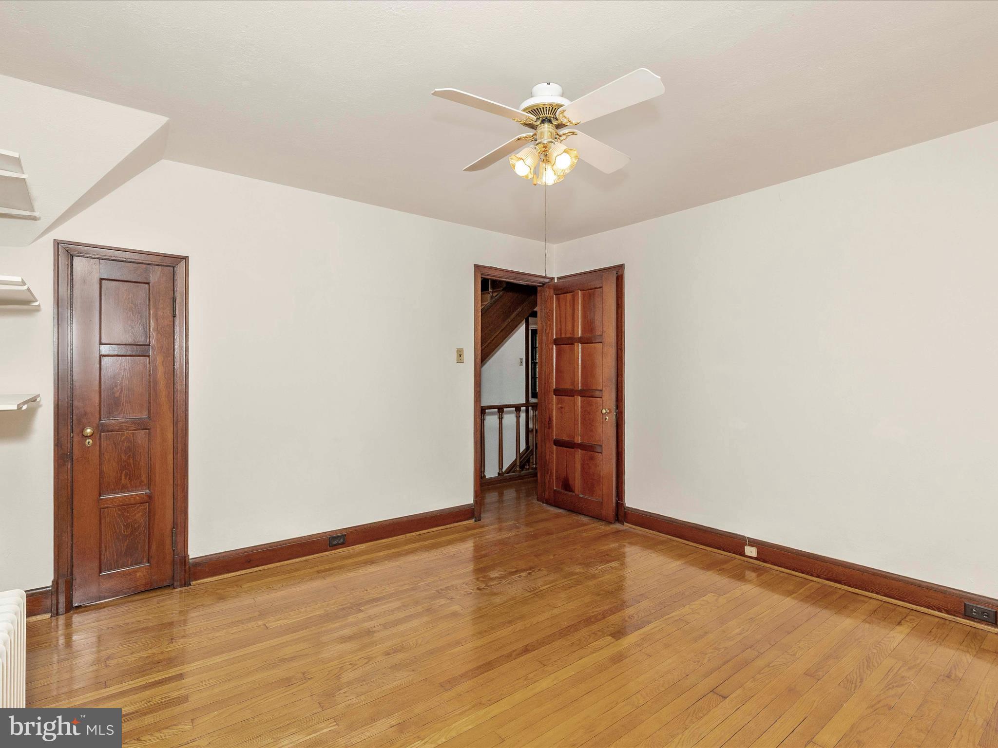 5100 Brook Green Road Baltimore, MD 21229 - Photo 31 of 54 a view of an empty room with wooden floor