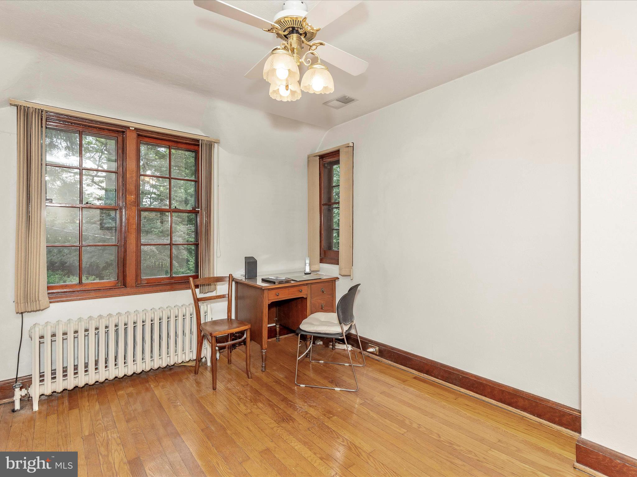 5100 Brook Green Road Baltimore, MD 21229 - Photo 32 of 54 a view of a dining room with furniture window and wooden floor