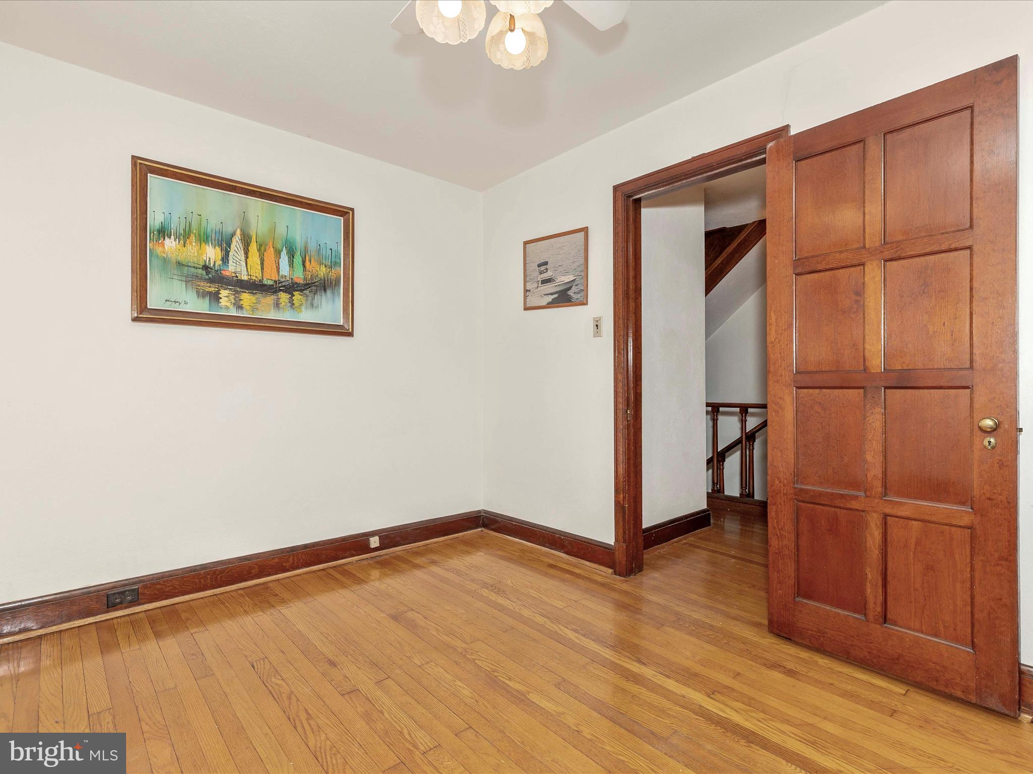 5100 Brook Green Road Baltimore, MD 21229 - Photo 33 of 54 an empty room with wooden floor closet and windows