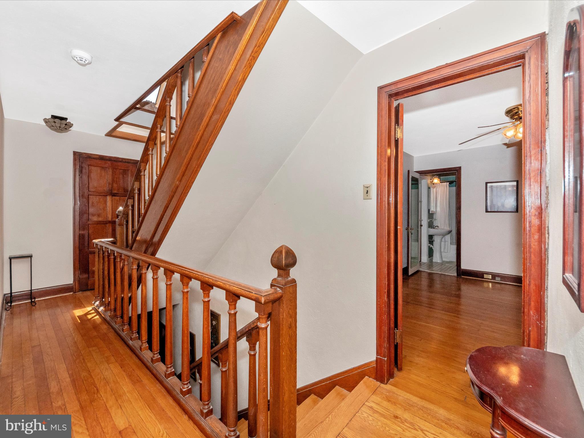 5100 Brook Green Road Baltimore, MD 21229 - Photo 35 of 54 a view of a hallway with wooden floor and staircase
