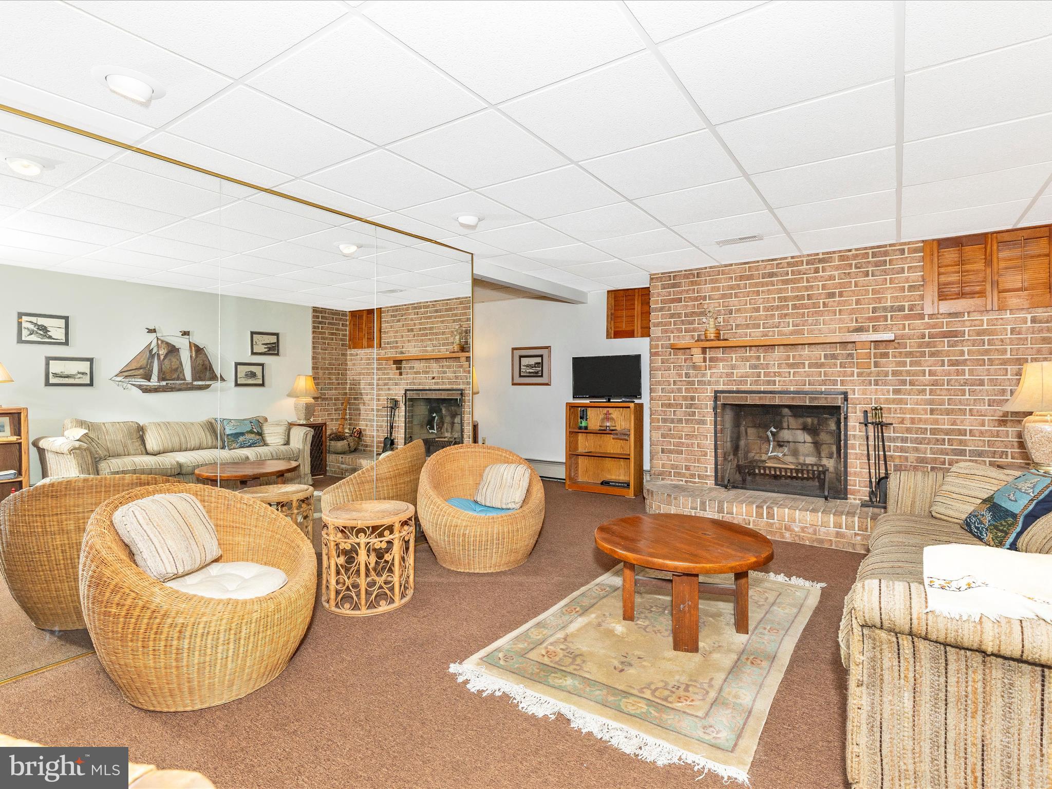 5100 Brook Green Road Baltimore, MD 21229 - Photo 40 of 54 a living room with furniture and a fireplace