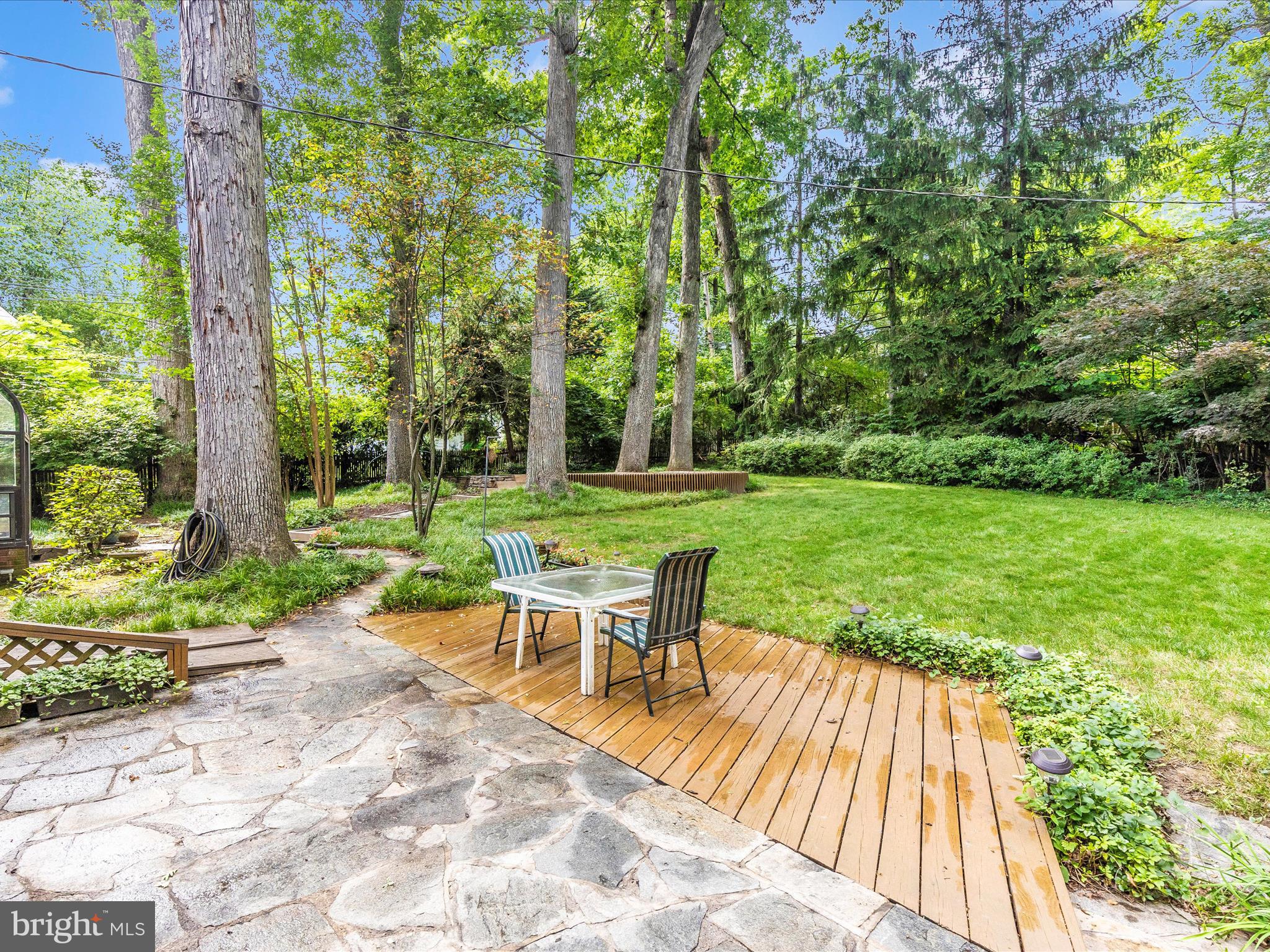 5100 Brook Green Road Baltimore, MD 21229 - Photo 45 of 54 a view of a chair and table on the wooden deck
