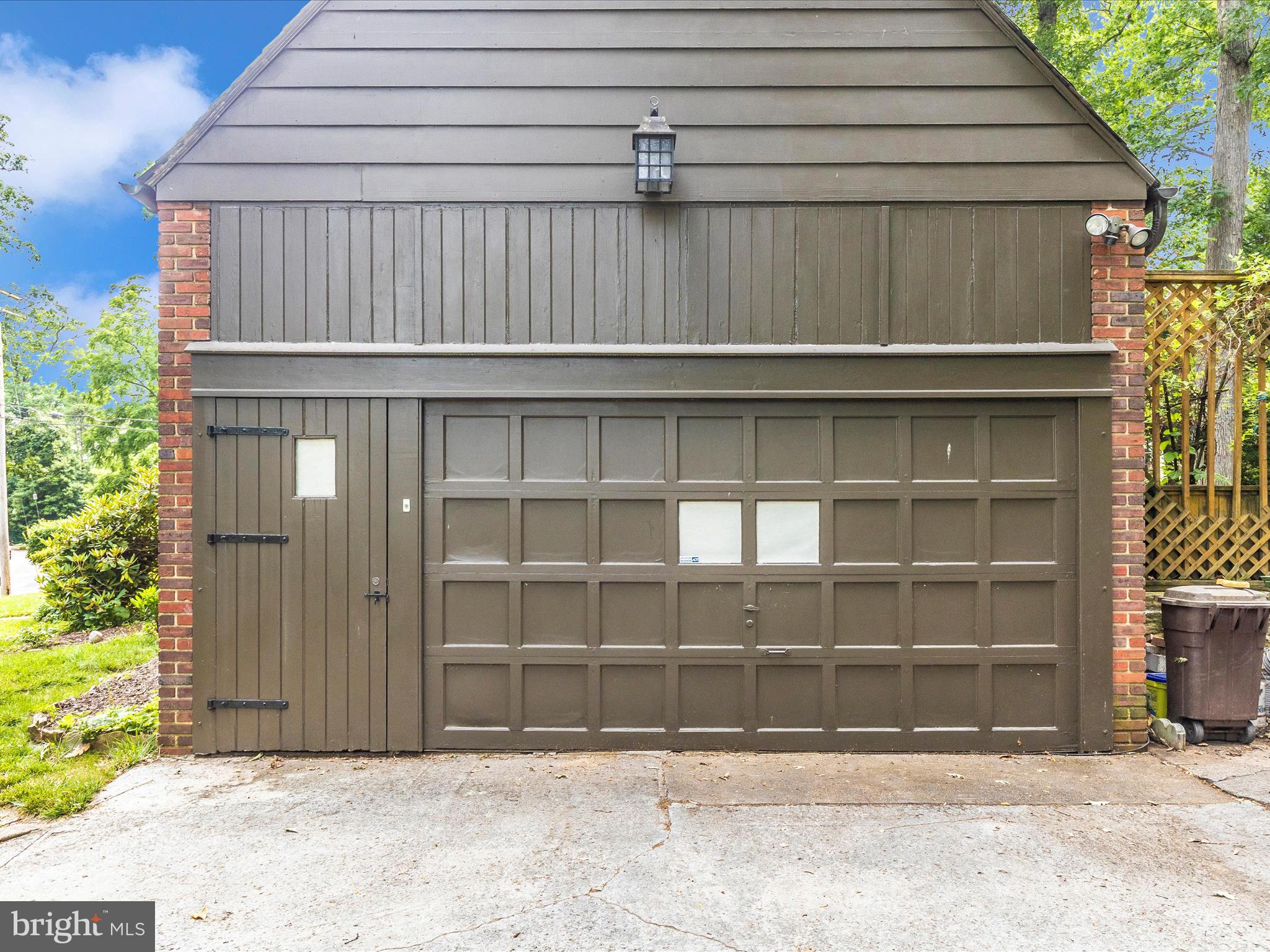 5100 Brook Green Road Baltimore, MD 21229 - Photo 51 of 54 a front view of a house with a yard and garage