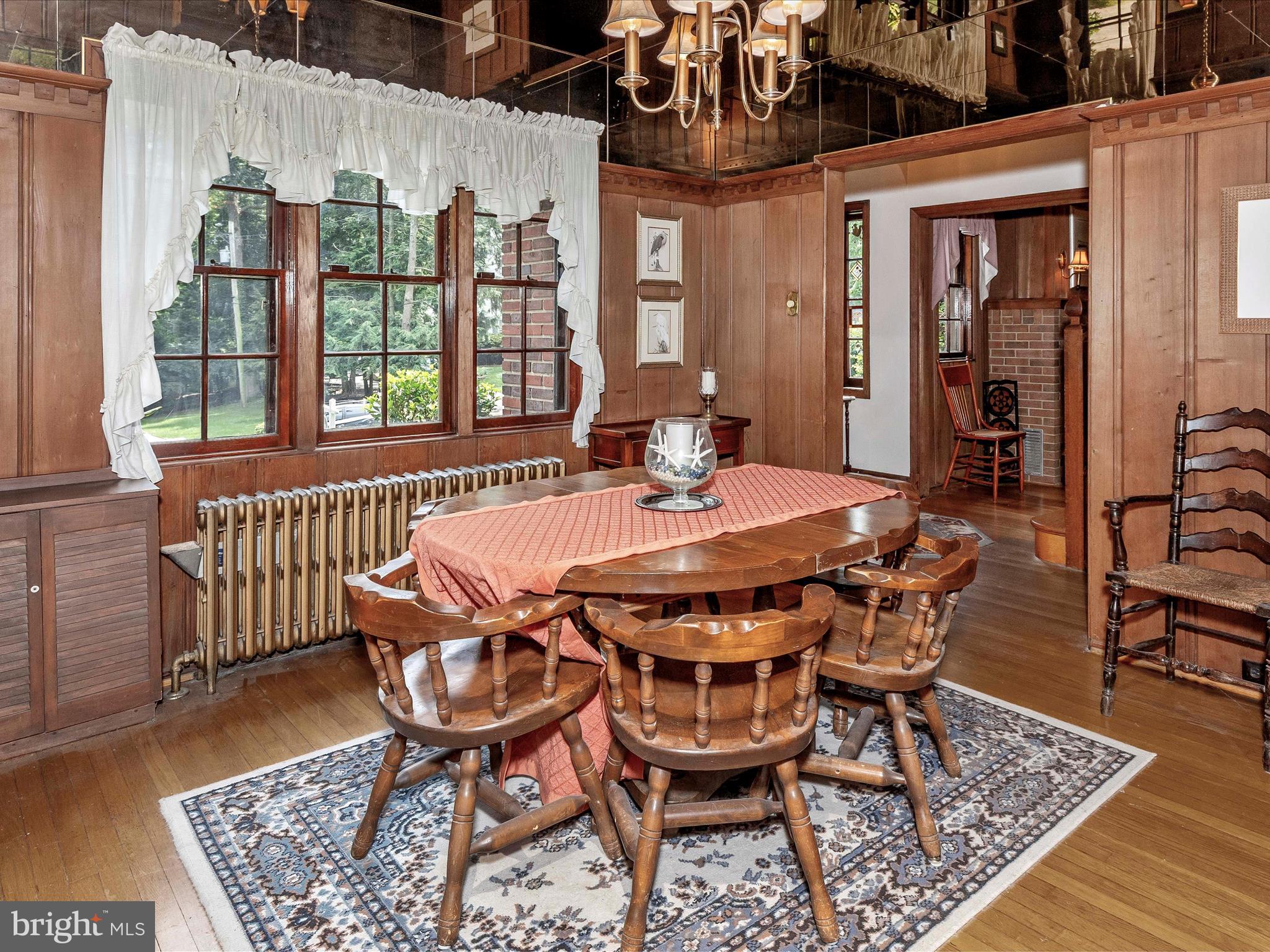 5100 Brook Green Road Baltimore, MD 21229 - Photo 10 of 54 a dining room with furniture and wooden floor