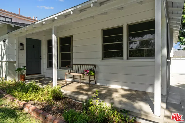 a view of house with backyard porch and entertaining space