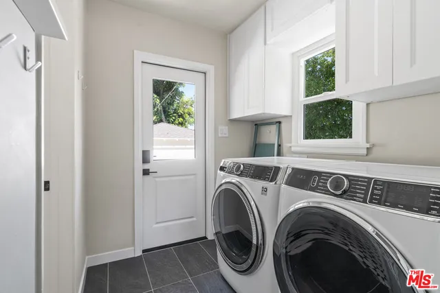 a utility room with closet dryer and washer