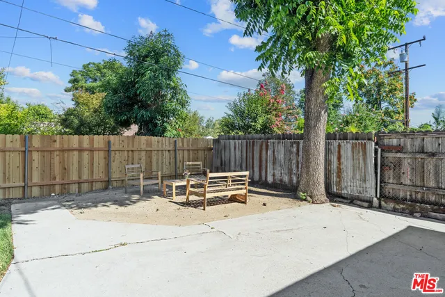 a view of outdoor space with wooden fence
