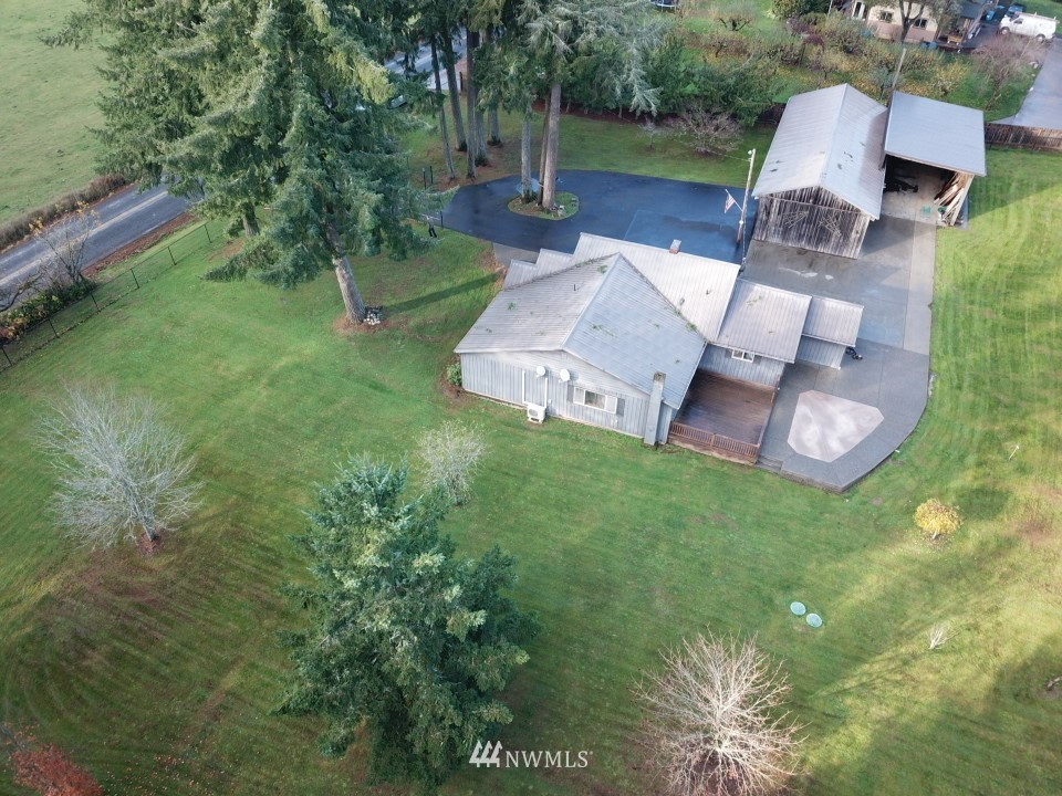 106 Pattee Road Chehalis, WA 98532 - Photo 1 of 33 an aerial view of a house with garden space sitting space and a fountain