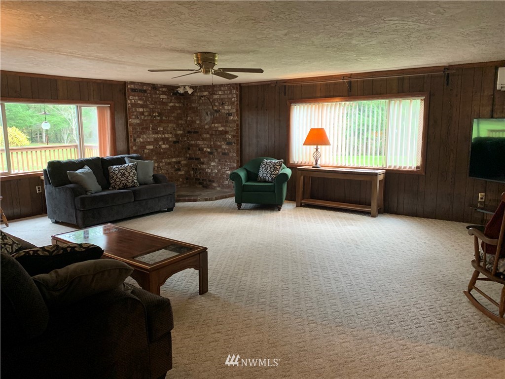 106 Pattee Road Chehalis, WA 98532 - Photo 11 of 33 a living room with furniture and a flat screen tv
