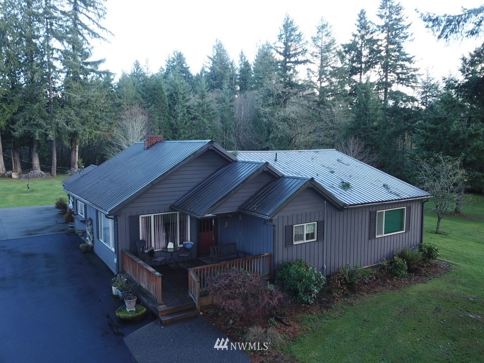 106 Pattee Road Chehalis, WA 98532 - Photo 25 of 33 a view of a house with a big yard plants and large trees