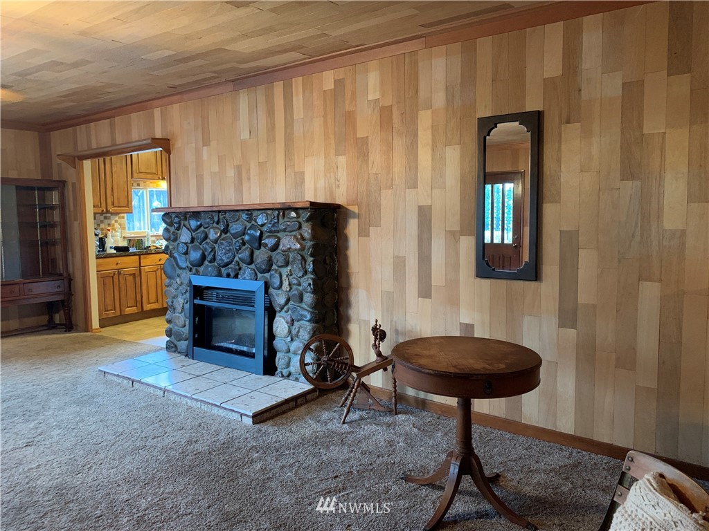 106 Pattee Road Chehalis, WA 98532 - Photo 9 of 33 a living room with furniture and a fireplace
