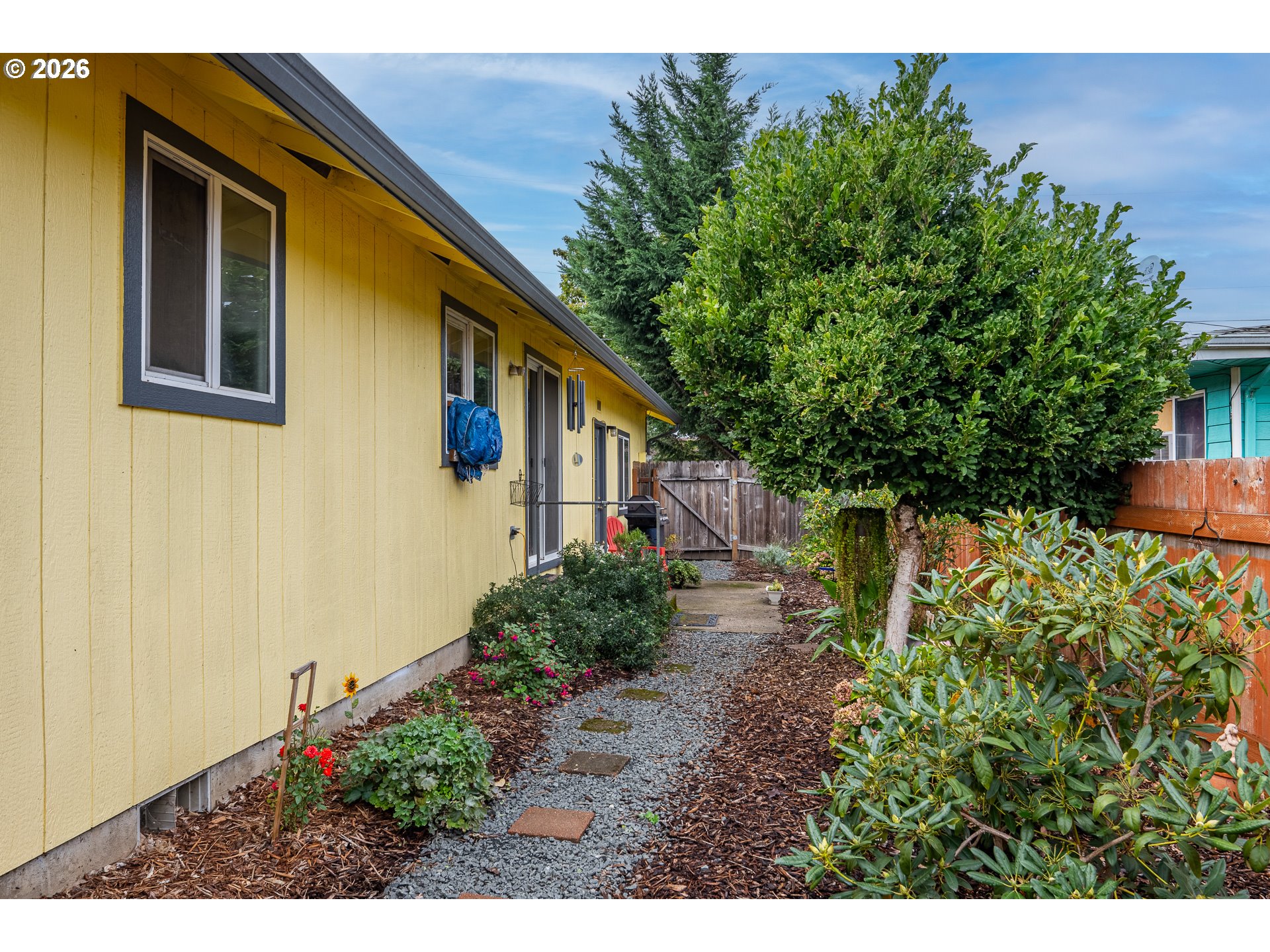 90 South 17th Street Cottage Grove, OR 97424 - Photo 20 of 23 a backyard of a house with lots of green space