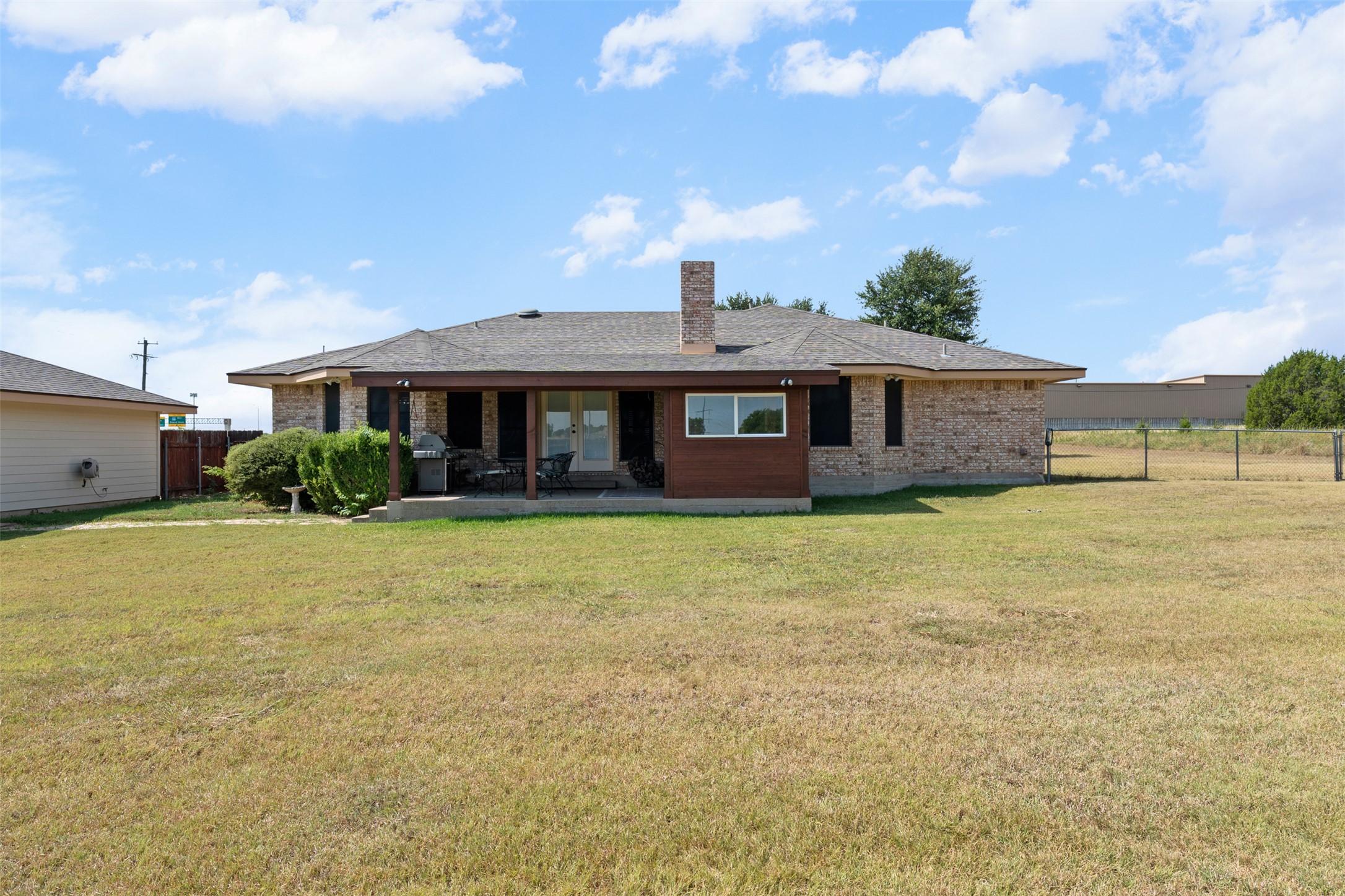 1512 Panther Loop Pflugerville, TX 78660 - Photo 34 of 40 A classic brick dwelling with a spacious backyard, perfect for outdoor enjoyment.