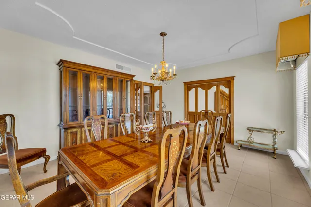 a kitchen with stainless steel appliances granite countertop a refrigerator a stove and a sink with cabinets