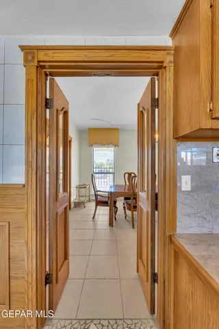 a living room with a fireplace and a large window