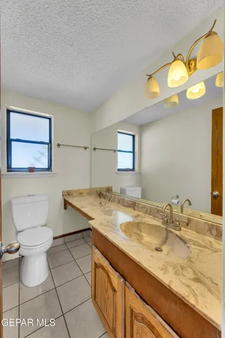 a bathroom with a sink and mirror