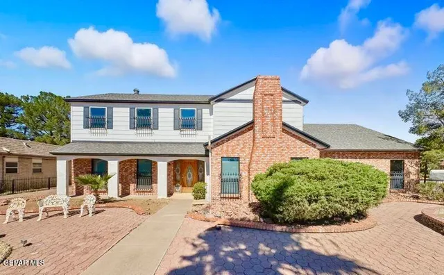 a front view of a house with a garage