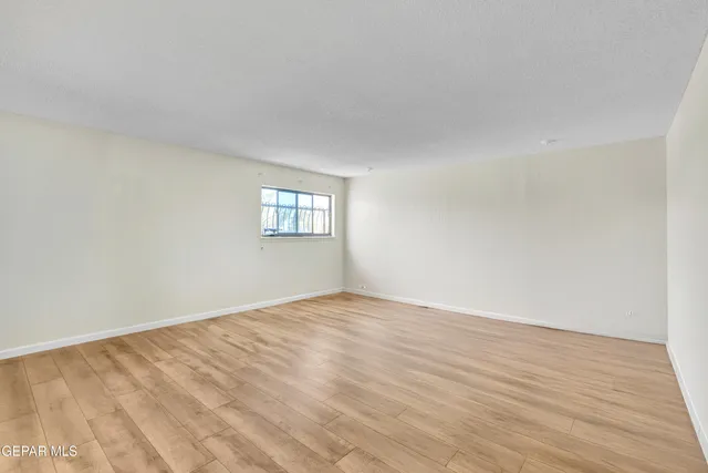 a view of empty room with windows