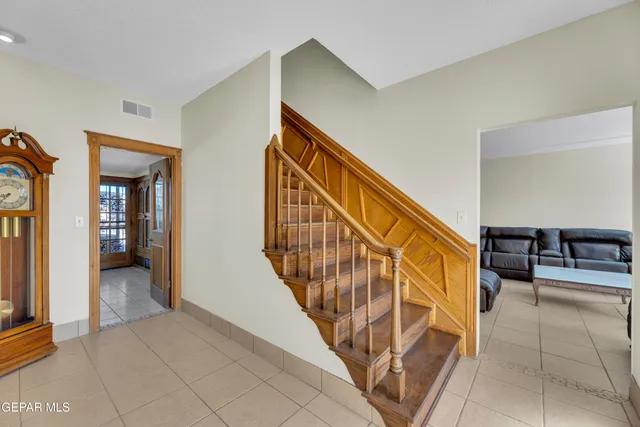 a view of a livingroom with furniture and floor to ceiling window