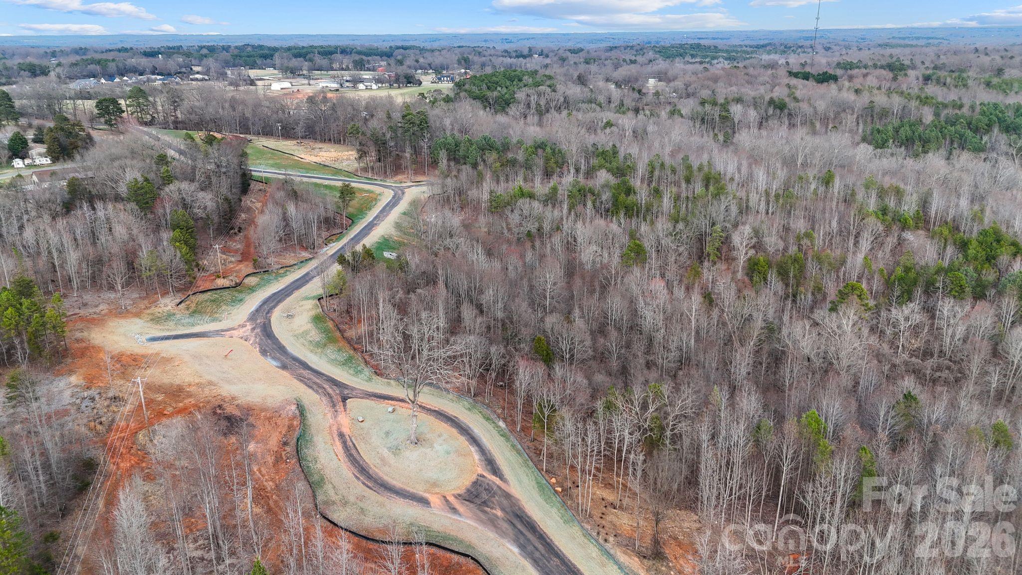 5700 Bentley Ridge Drive, Unit 12 Davidson, NC 28036 - Photo 19 of 25 a view of a balcony with wooden floor and lake view
