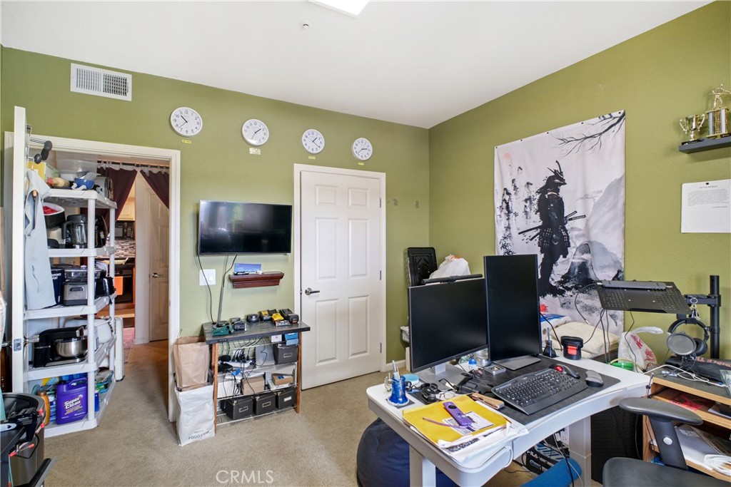 1390 Saddle Rack Street, Unit 308 San Jose, CA 95126 - Photo 15 of 32 a room with furniture and a flat screen tv