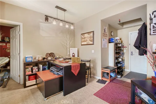 a view of a living room and dining room
