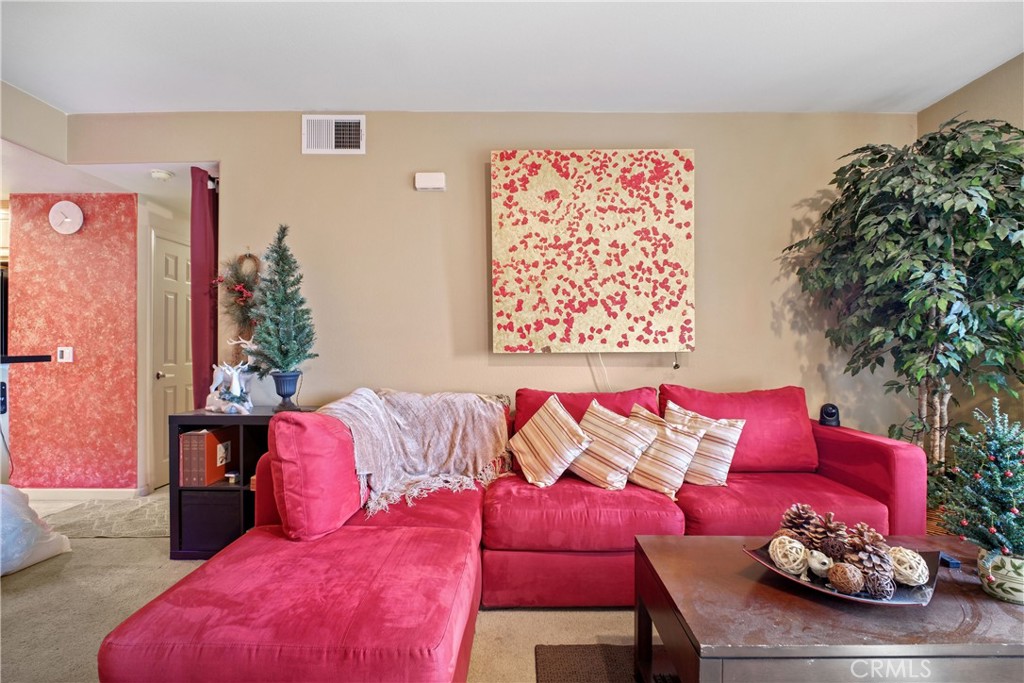 1390 Saddle Rack Street, Unit 308 San Jose, CA 95126 - Photo 3 of 32 a living room with furniture and a potted plant
