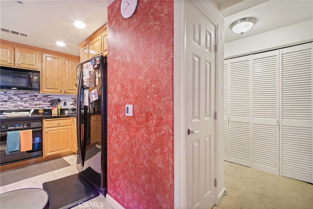 1390 Saddle Rack Street, Unit 308 San Jose, CA 95126 - Photo 5 of 32 a bathroom with a granite countertop sink and a mirror