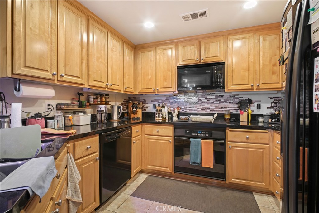 1390 Saddle Rack Street, Unit 308 San Jose, CA 95126 - Photo 6 of 32 a kitchen with stainless steel appliances granite countertop a stove a sink dishwasher and a refrigerator