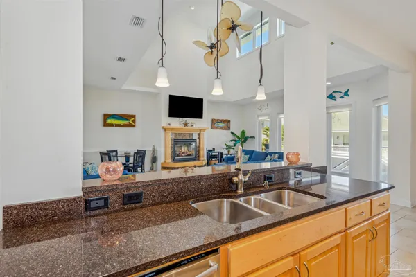 a kitchen with stainless steel appliances a sink a stove and a microwave