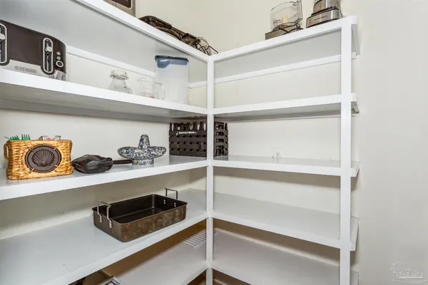 a view of storage and utility room with two washing machine