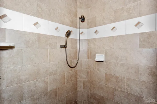 a bathroom with a shower and a shower
