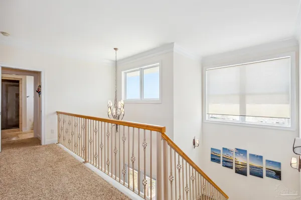 a view of a hallway with windows
