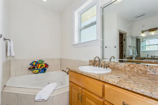 a bathroom with a sink double vanity and a granite