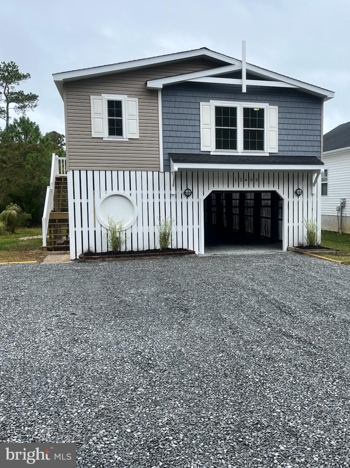 12403 Salisbury Road Ocean City, MD 21842 - Photo 1 of 28 a view of a house with a yard