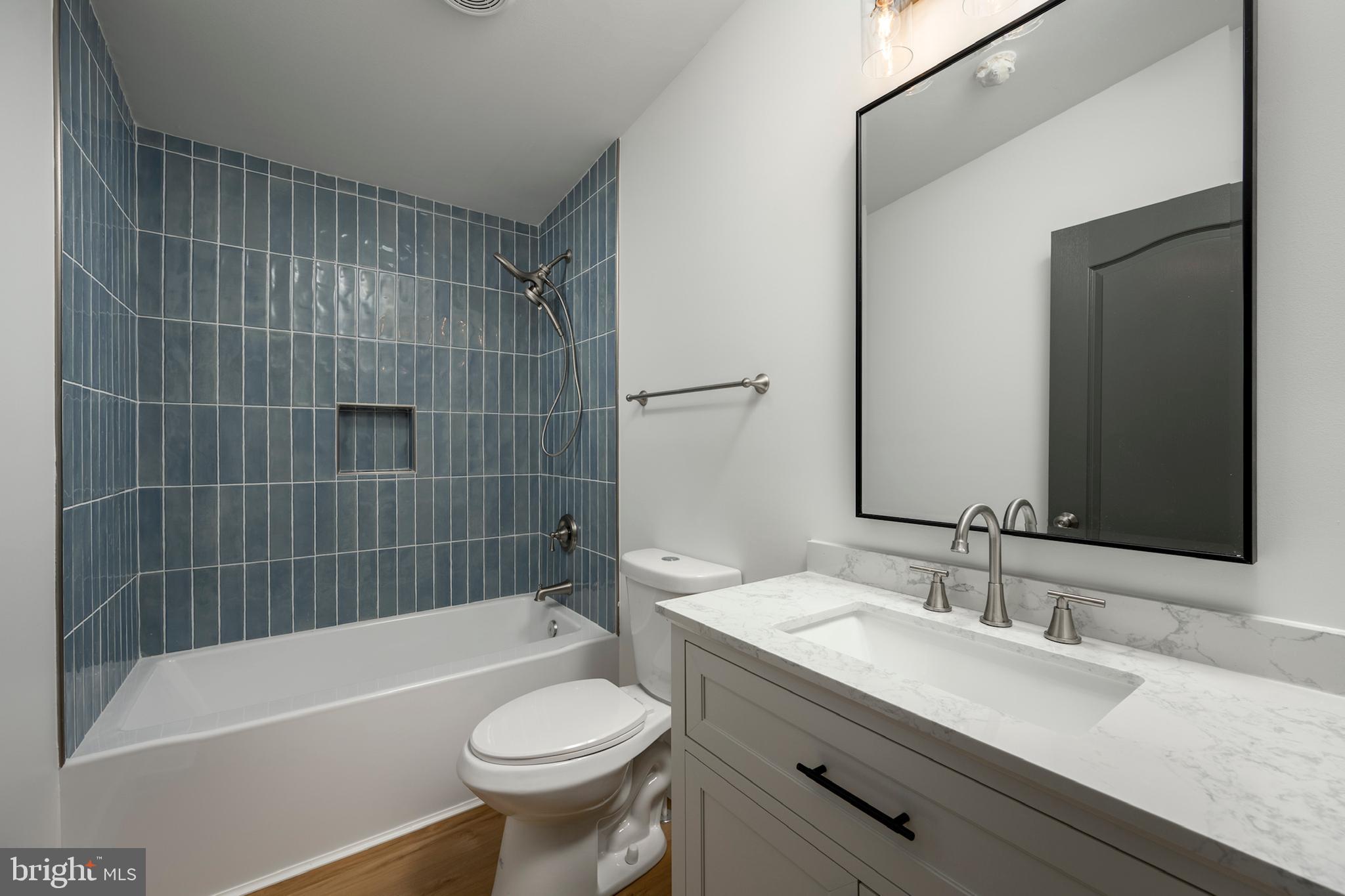 12403 Salisbury Road Ocean City, MD 21842 - Photo 28 of 28 a bathroom with a sink a toilet and bathtub