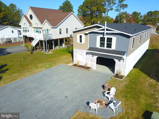 an aerial view of a house with swimming pool yard and balcony
