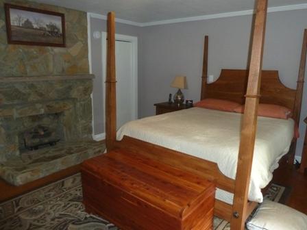 1709 6 Mile Post Road Callaway, VA 24067 - Photo 13 of 36 a bedroom with a bed and wooden floor
