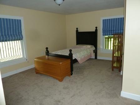 1709 6 Mile Post Road Callaway, VA 24067 - Photo 19 of 36 a bedroom with a bed and a window