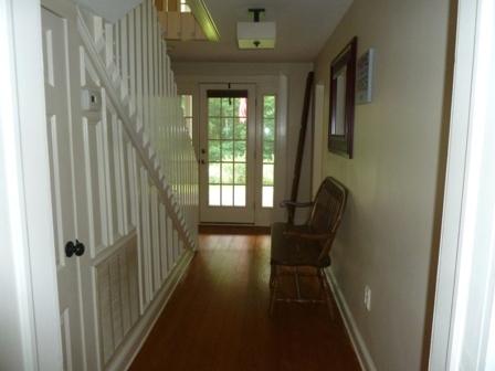 1709 6 Mile Post Road Callaway, VA 24067 - Photo 3 of 36 a view of a hallway with wooden floor and stairs