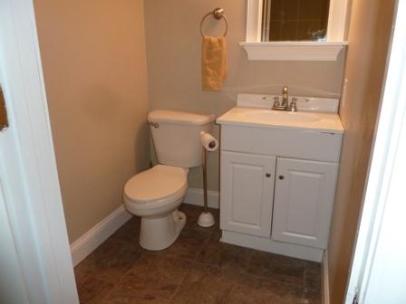 1709 6 Mile Post Road Callaway, VA 24067 - Photo 21 of 36 a bathroom with a toilet sink and mirror
