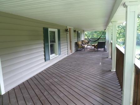 1709 6 Mile Post Road Callaway, VA 24067 - Photo 23 of 36 a view of a patio with table and chairs with wooden floor and fence