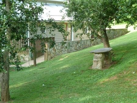 1709 6 Mile Post Road Callaway, VA 24067 - Photo 27 of 36 a view of a garden with a bench