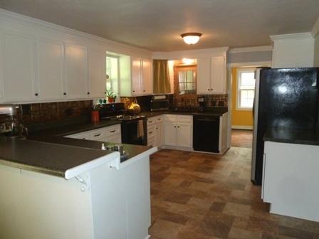 1709 6 Mile Post Road Callaway, VA 24067 - Photo 7 of 36 a kitchen with a sink and cabinets