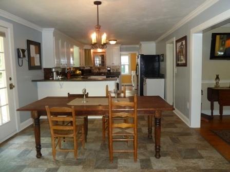 1709 6 Mile Post Road Callaway, VA 24067 - Photo 9 of 36 a view of a dining room with furniture and a chandelier