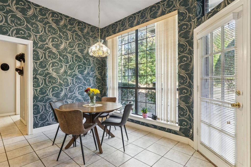 3825 Montecito Drive Denton, TX 76205 - Photo 14 of 37 a dining room with furniture and chandelier
